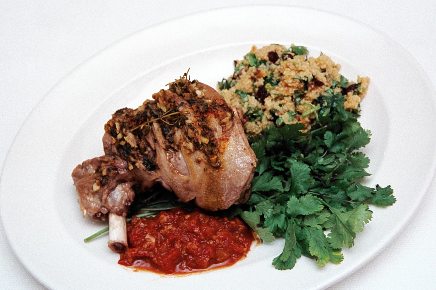 Steamed North African Leg of Lamb with Fruit Cous Cous ready to be carved