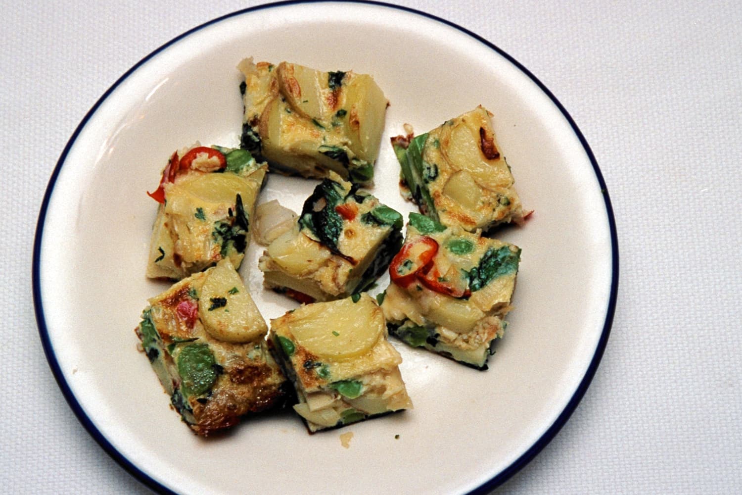 Broad Beans and New Potato Tortilla in bite-sized pieces